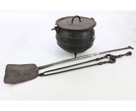 A cast iron cauldron shaped pan and cover, pair of cast metal fire tongs and a cast metal fireplace peel (3).