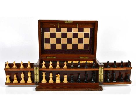 F H AYRES, LONDON; a 19th century mahogany games compendium, the hinged cover enclosing a leather folding board with bone dom