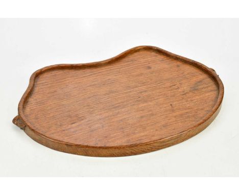 WORKSHOP OF ROBERT MOUSEMAN THOMPSON; an adzed oak kidney shaped tray, width 46cm,Condition Report: Heat marks and staining t
