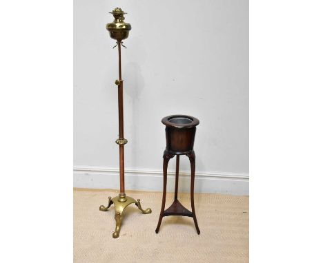 A Victorian copper and brass telescopic oil lamp with frosted glass shade, height 152cm and a mahogany jardinière stand with 
