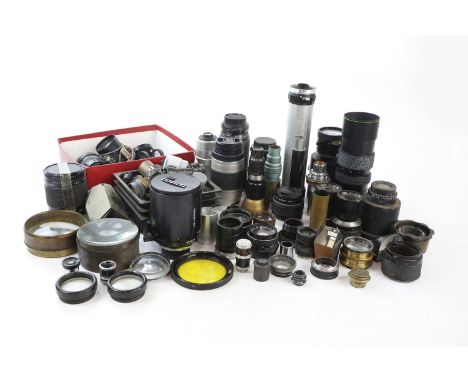 A collection of lenses, mostly screw mount, to include a Tamron SP 500mm f8, a Konica 50mm f1.4,a Minolta 75mm-500mm f4.5-f5.