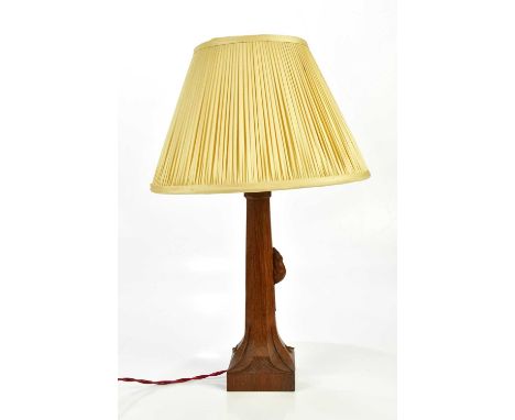WORKSHOP OF ROBERT MOUSEMAN THOMPSON; an oak octagonal table lamp, height 28.5cm.Condition Report: Nice golden patina, small 