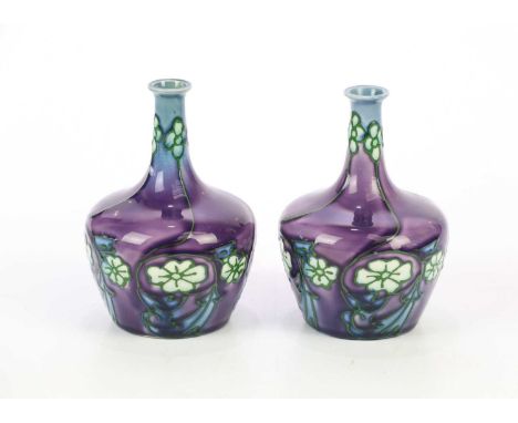LEON VICTOR SOLOMON & JOHN WADSWORTH FOR MINTON; a pair of Secessionist vases of squat form with cylindrical necks, with tube
