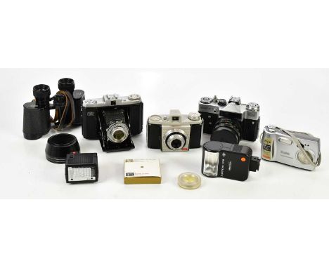A collection of film and digital cameras, to include a Zenit EM, a Colorsnap, a Kodak Easy Share, together with flash guns an