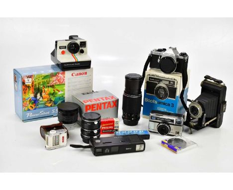 A collection of cameras, to include a Pentax ME Sport with a Pentax 80mm-200mm f4.5 lens, a Canon Powershot S50 digital camer