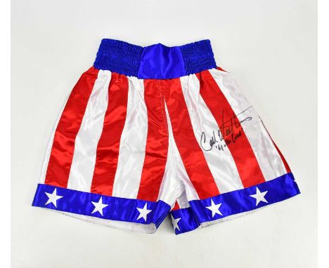 CARL WEATHERS; a signed pair of Stars and Stripes boxing shorts, size S.Condition Report: Light creasing throughout, no certi