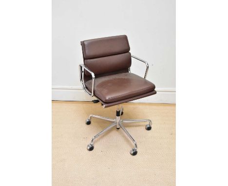 AFTER CHARLES &amp; RAY EAMES FOR VITRA; a contemporary brown leather and chrome swivel office chair.Condition Report: Marks 