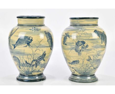 FANNY STABLE FOR DOULTON FAIENCE; a near pair of late 19th century blue and white aquatic vases decorated with fish, toads, w