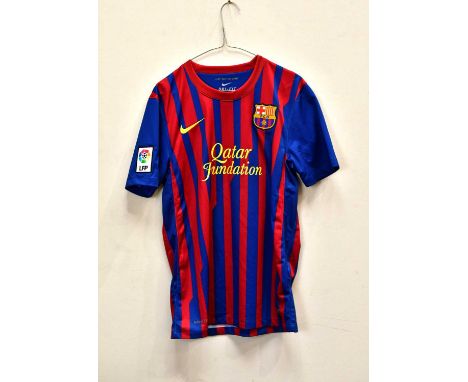 LIONEL MESSI; a signed Barcelona football shirt, signed verso, size S.Condition Report: Light creasing throughout, no certifi