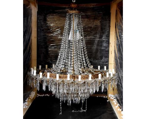 An impressive modern gilt metal twenty-four branch ceiling light with cut glass droplets and driptrays, height 136cm.Conditio