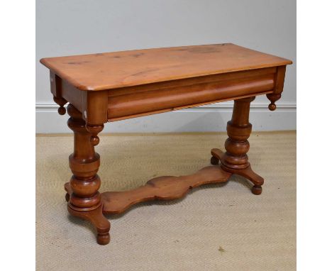An old pine console table, with single frieze drawer, on bulbous form columns terminating on ball feet, width 102cm, height 6