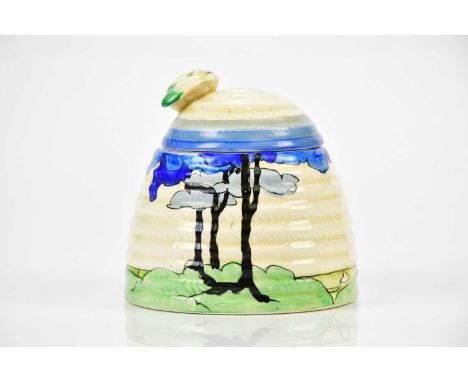 CLARICE CLIFF; a Bizarre Beehive honeypot and cover in the 'Blue Firs' pattern, height 9cm.Condition Report: The cover has ti