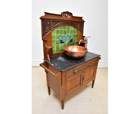 An Art Nouveau marble top wash stand, later converted as a fully functioning bathroom unit, with green glazed tiled back, abo