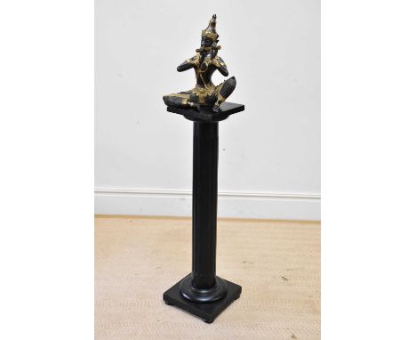 A decorative bronze figure of a seated Thai deity playing the flute, height 39cm, with ebonised stand, height 106cm.Condition
