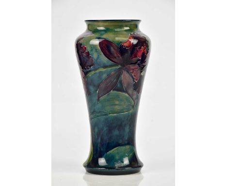 WILLIAM MOORCROFT; a vase of tapering form in 'Purple Orchid' pattern on an ochre ground, green signature and impressed Bursl