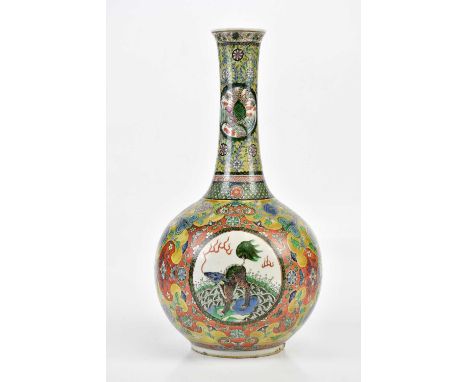 A large Chinese Famille Verte vase of baluster form, decorated with a peacock in landscape, four claw dragon, symbols and flo