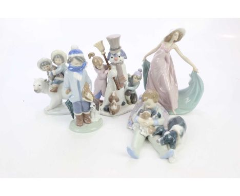 LLADRÓ; five ceramic figures including children making a snowman, height 20cm, a boy next to a puppy, etc (5)Condition Report