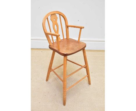 An Ercol style child's high chair, height 82cm.