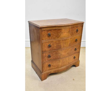 A 1950s walnut serpentine fronted chest of four drawers, on bracket feet, width 79cm, depth 45cm, height 83cm.