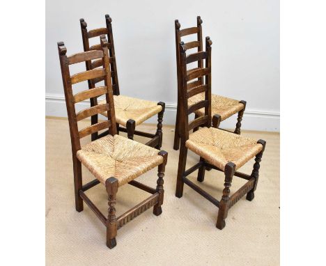 A set of four 19th century ladder back rush seated oak chairs.