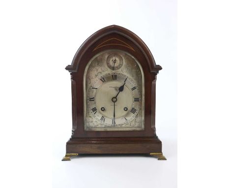 H. PEARCE &amp; SONS; an early 20th century mahogany cased mantel clock, the silvered dial set with Roman numerals, height 31