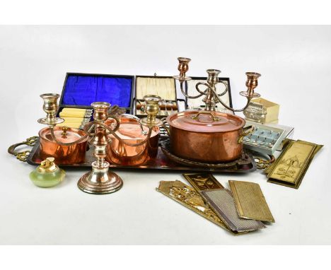 A collection of assorted metalware including an Eastern twin handled tray, a Sheffield plate candlestick etc.Condition Report