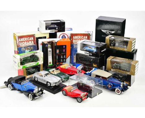 A collection of diecast model cars including a 1933 Duesenberg, 1954 Mercedes-Benz 300 SL, a 1948 MG TC Roadster, a Jaguar Mk
