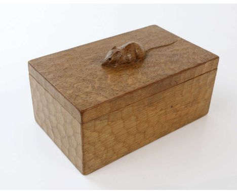 WORKSHOP OF ROBERT MOUSEMAN THOMPSON; an adzed oak trinket box and cover, length 18cm.Condition Report: Limed affect to the b