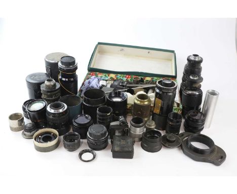 A collection of camera lenses and other lenses, to include a Pentax f2.8, a Takumar 28mm-80mm f3.5-f4.5, a Soligor 28mm f2.8,