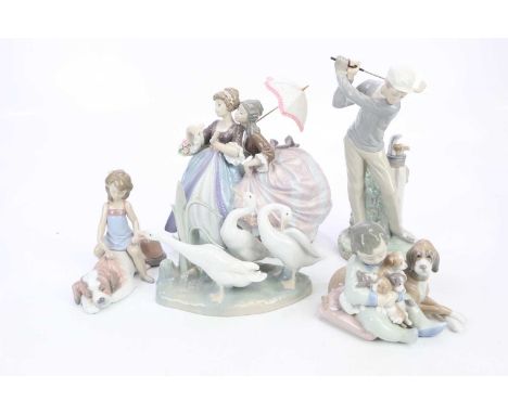 LLADRÓ; a large figure of two ladies with ballroom dresses, height 23cm, model of children beside puppy, model of geese and a