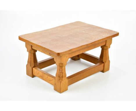 WORKSHOP OF ROBERT MOUSEMAN THOMPSON; a light oak stool with adzed top on four block feet, length 41m, depth 28cm, height 20c