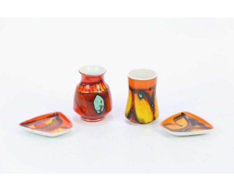 POOLE POTTERY; four pieces decorated in the 'Delphis' range, comprising two small vases and two pin dishes, fitted in origina