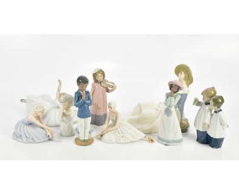 NAO; a collection of five figures including girl playing violin, ballerina, choir boys, etc, together with a Lladro cherub an