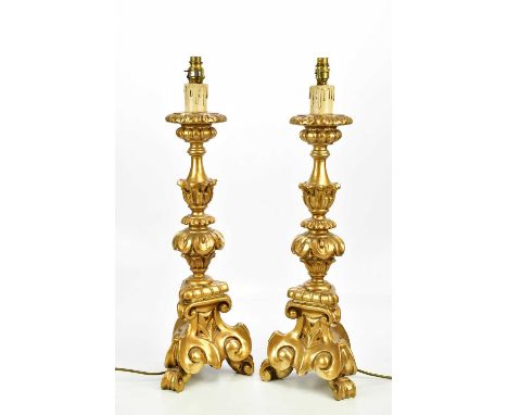 A pair of modern ornate gilt painted table lamps, height 72cmCondition Report: PLEASE NOTE THAT THIS LOT IS NOT SUITABLE FOR 