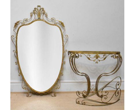 A modern gilt metal console table (lacking top) with matching shield shaped wall mirror, height 150cm (2).