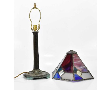 A Tiffany style patinated metal table lamp, with indistinct cast mark ‘Barn / Farm’, with stained glass shade, height 54cm.