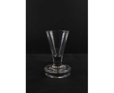 A late 18th century firing glass, height 10.5cm.Condition Report: Light patina of surface wear / scratches throughout the bas