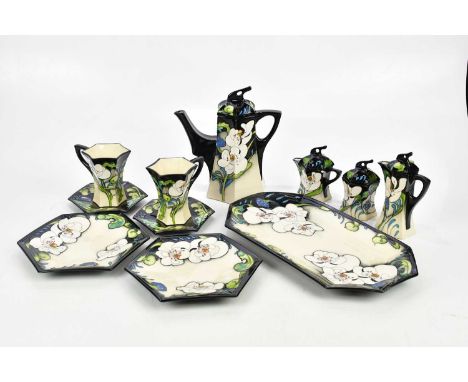 MOORCROFT; a rare and unusual 'Au Lait' eleven piece service, boxed.Condition Report: Boxes with mould and damp marks, the li