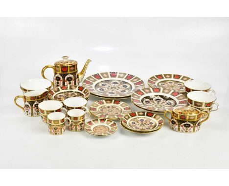 ROYAL CROWN DERBY; a 'Old Imari' pattern part tea set to include two large cups and saucers, two coffee cans and saucers, two