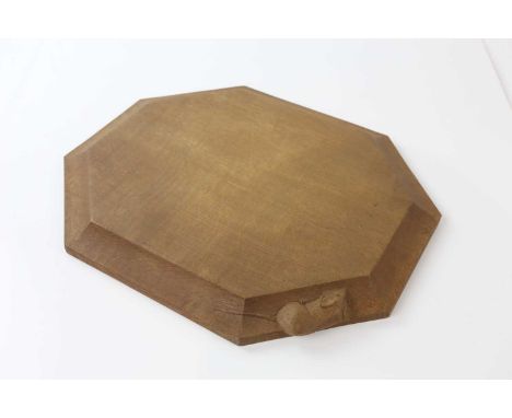 WORKSHOP OF ROBERT MOUSEMAN THOMPSON; a shaped octagonal breadboard, length 31cm.
