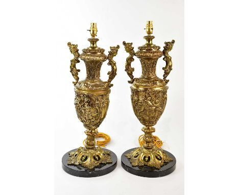A pair of mid 20th century urn form Rococo style table lamps with circular black marble bases, height 65cm.Condition Report: 