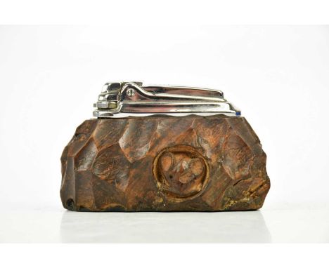 ROBERT MOUSEMAN THOMPSON; a carved oak Ronson table lighter, length 10cm.Condition Report: Minor splitting and wear throughou