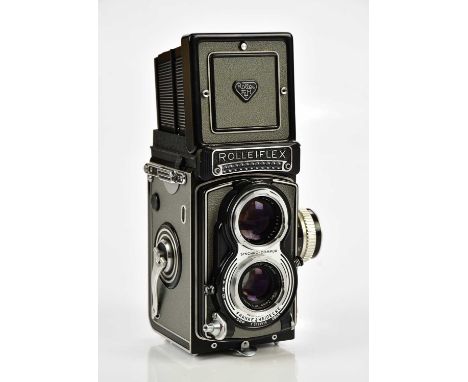 ROLLEIFLEX; a Rolleiflex T TLR camera, grey, serial No 2129515, with a Tessar 75mm f3.5 lens, serial No 2702859, with leather