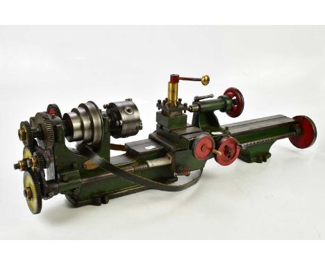 A model maker's lathe and a quantity of tooling, wood cutting tools etc.