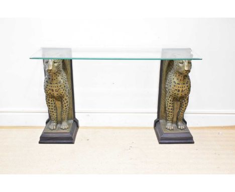 WILLIE BOTHA; a modern glass top console table with a pair of leopard pedestals, height 90cm, width 150cm, depth 43cm.Conditi