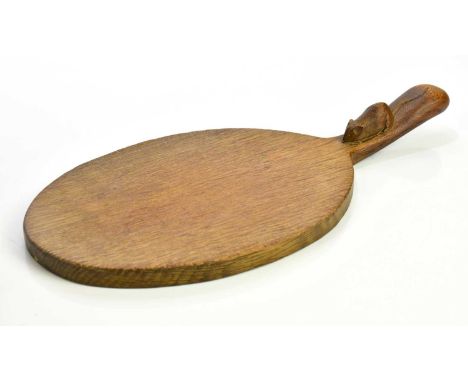 WORKSHOP OF ROBERT MOUSEMAN THOMPSON; an oak cheeseboard of oval form with mouse to handle, length 37cm.Condition Report: Num