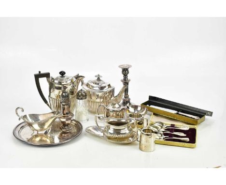 A small collection of plated items including tea service, sugar caster, candlestick, etc.