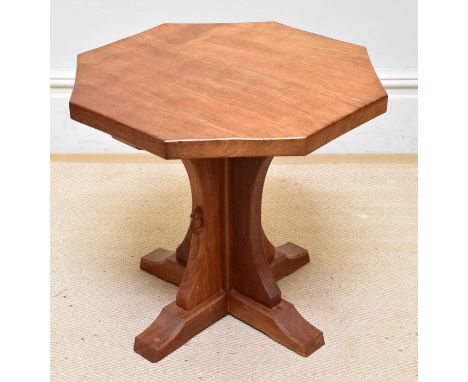 WORKSHOP OF ROBERT MOUSEMAN THOMPSON; an adzed oak octagonal coffee table, height 47cm, width 49cm.