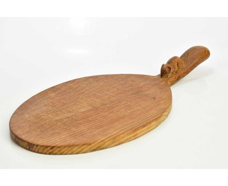 ROBERT MOUSEMAN THOMPSON; an oak cheeseboard of oval form, with carved mouse to handle, length 37cm.Condition Report: Heavy w