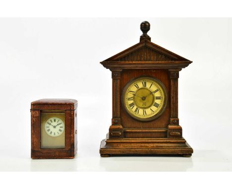 An early 20th century French brass cased carriage clock with champlevé type enamel panels, the enamel dial set with Roman num